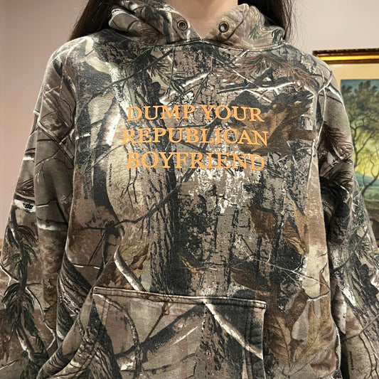 DUMP YOUR REPUBLICAN BOYFRIEND camo hoodie with orange text (XL)