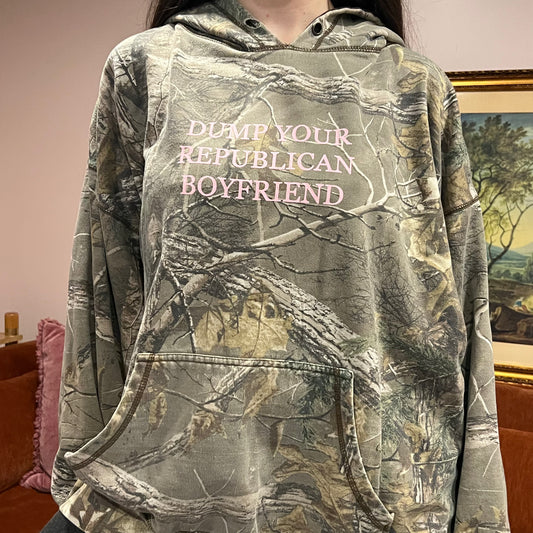 DUMP YOUR REPUBLICAN BOYFRIEND camo hoodie with pink text (2XL)