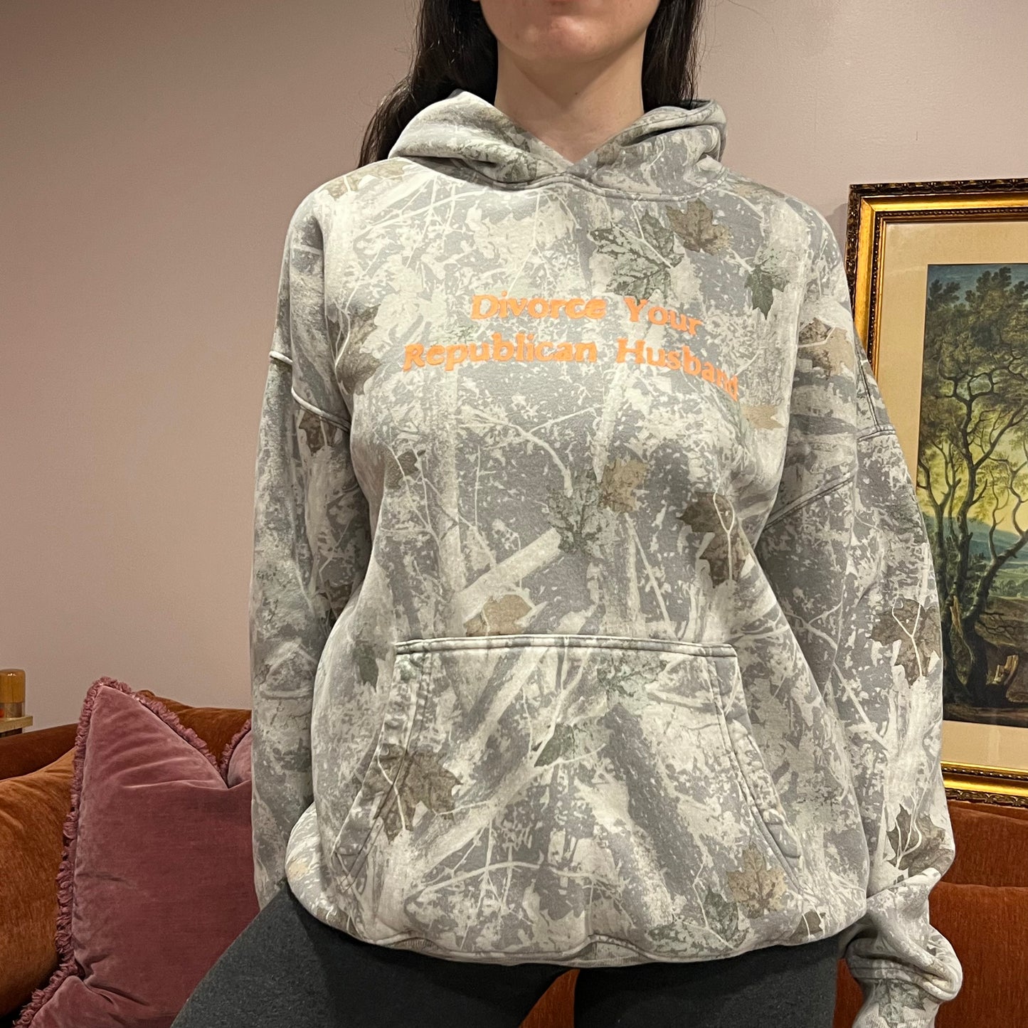 DIVORCE YOUR REPUBLICAN HUSBAND white camo hoodie with orange text (L)