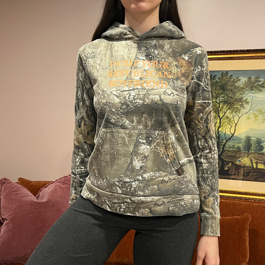 DUMP YOUR REPUBLICAN BOYFRIEND camo hoodie with orange text (S)