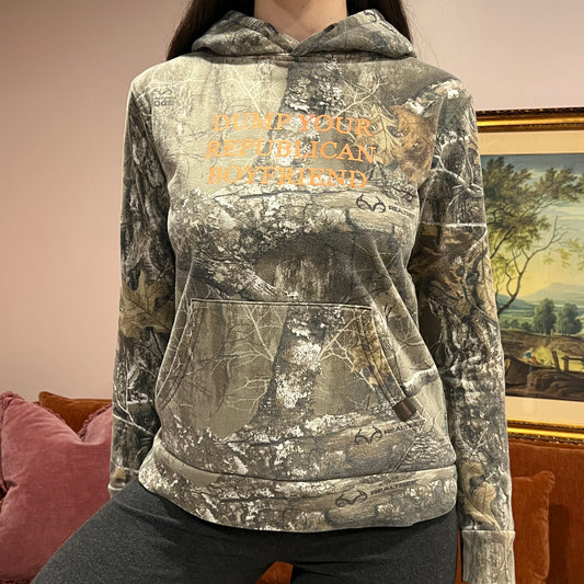 DUMP YOUR REPUBLICAN BOYFRIEND camo hoodie with orange text (S)