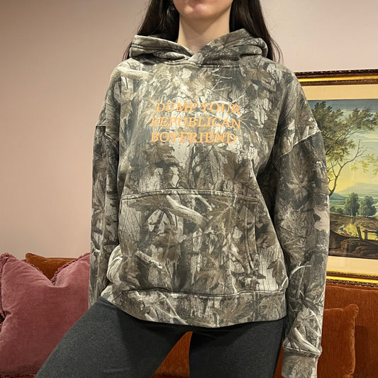DUMP YOUR REPUBLICAN BOYFRIEND camo hoodie with orange text (M)