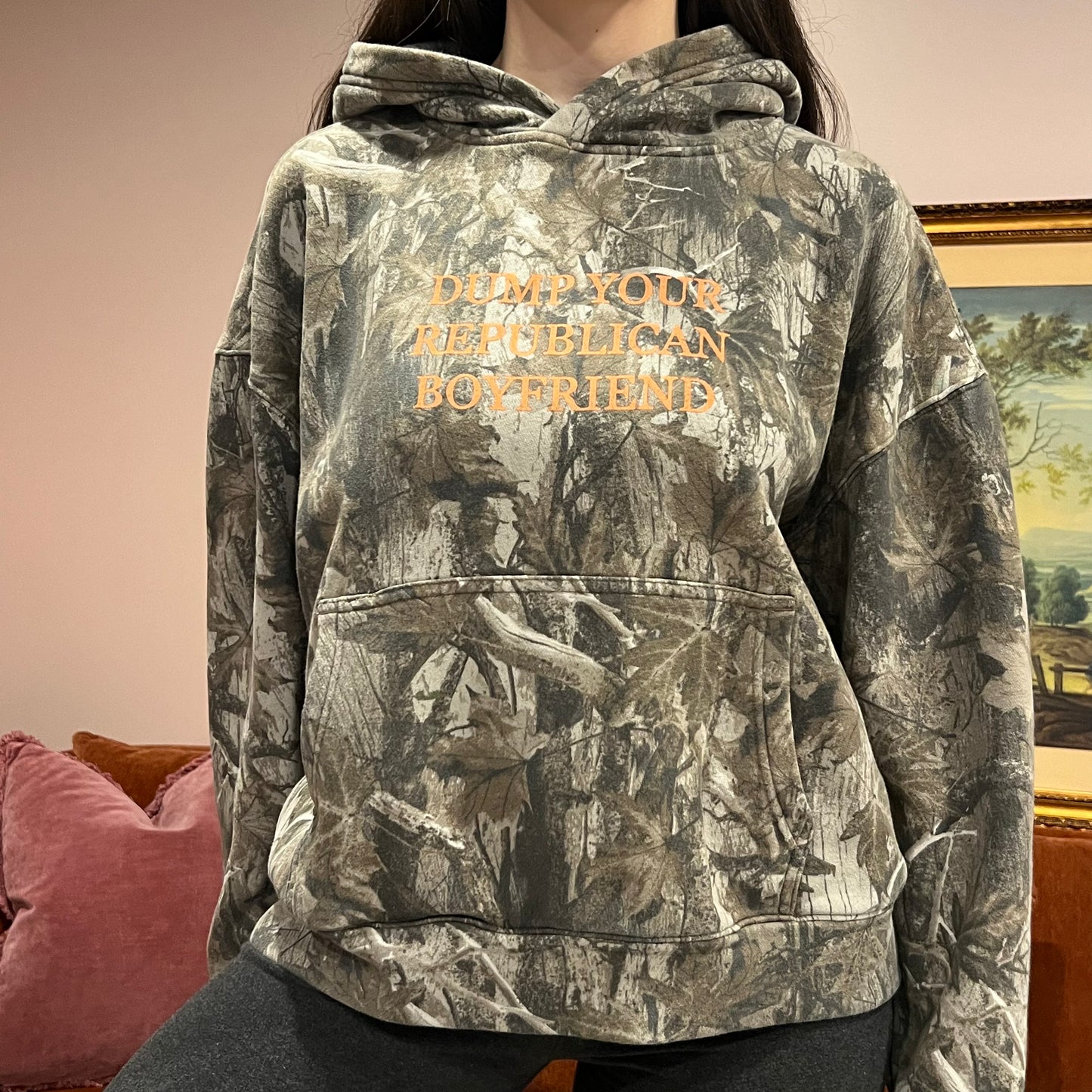 DUMP YOUR REPUBLICAN BOYFRIEND camo hoodie with orange text (M)
