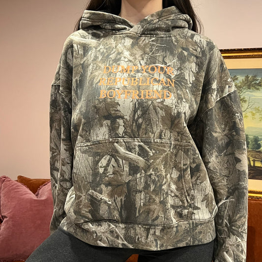 DUMP YOUR REPUBLICAN BOYFRIEND camo hoodie with orange text (M)