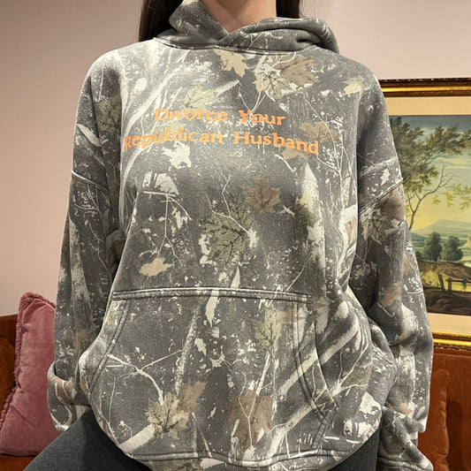 DIVORCE YOUR REPUBLICAN HUSBAND camo hoodie with orange text (L)