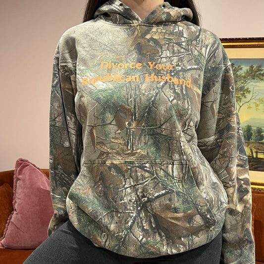 DIVORCE YOUR REPUBLICAN HUSBAND camo hoodie with orange text (L)