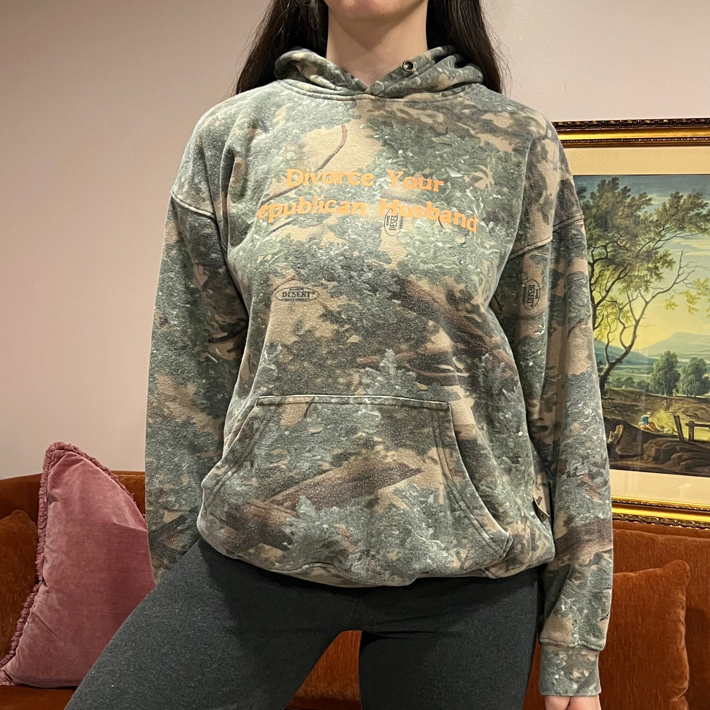 DIVORCE YOUR REPUBLICAN HUSBAND camo hoodie with orange text (M)