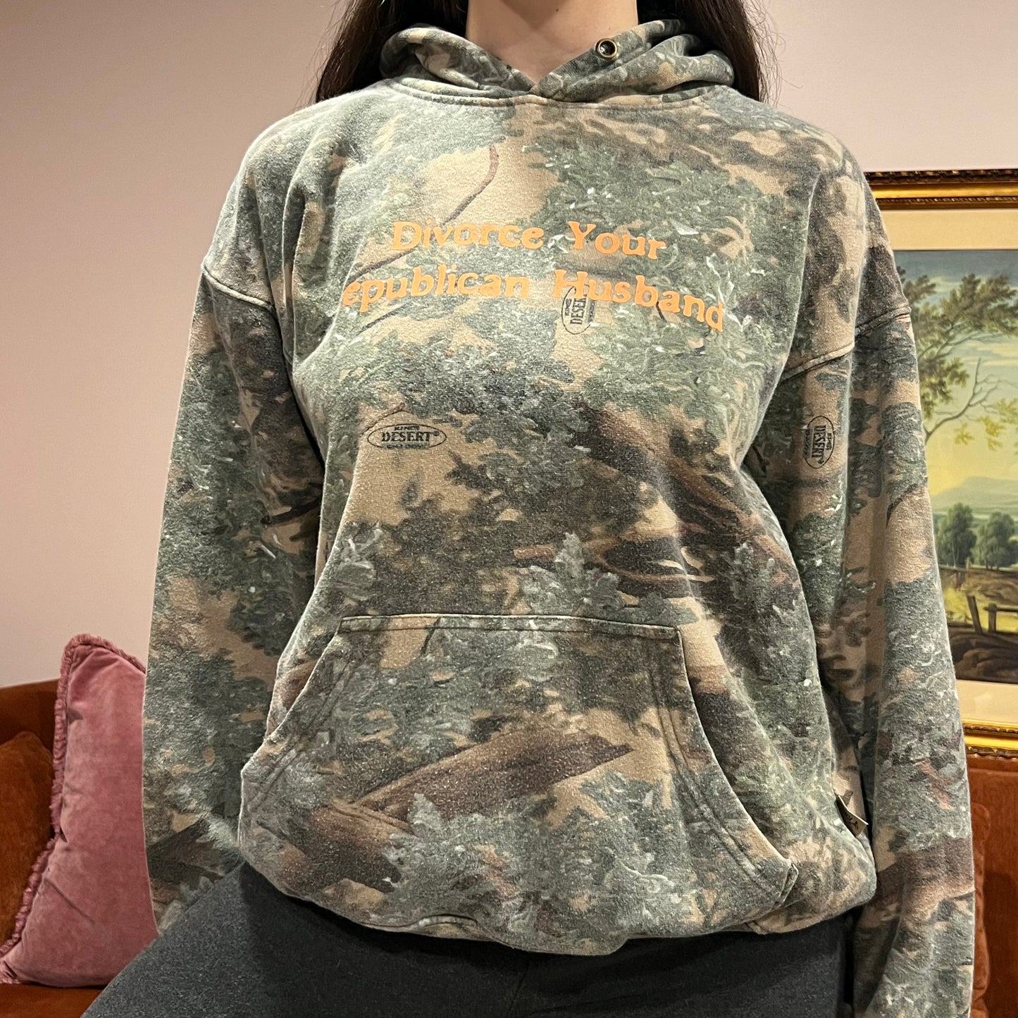 DIVORCE YOUR REPUBLICAN HUSBAND camo hoodie with orange text (M)