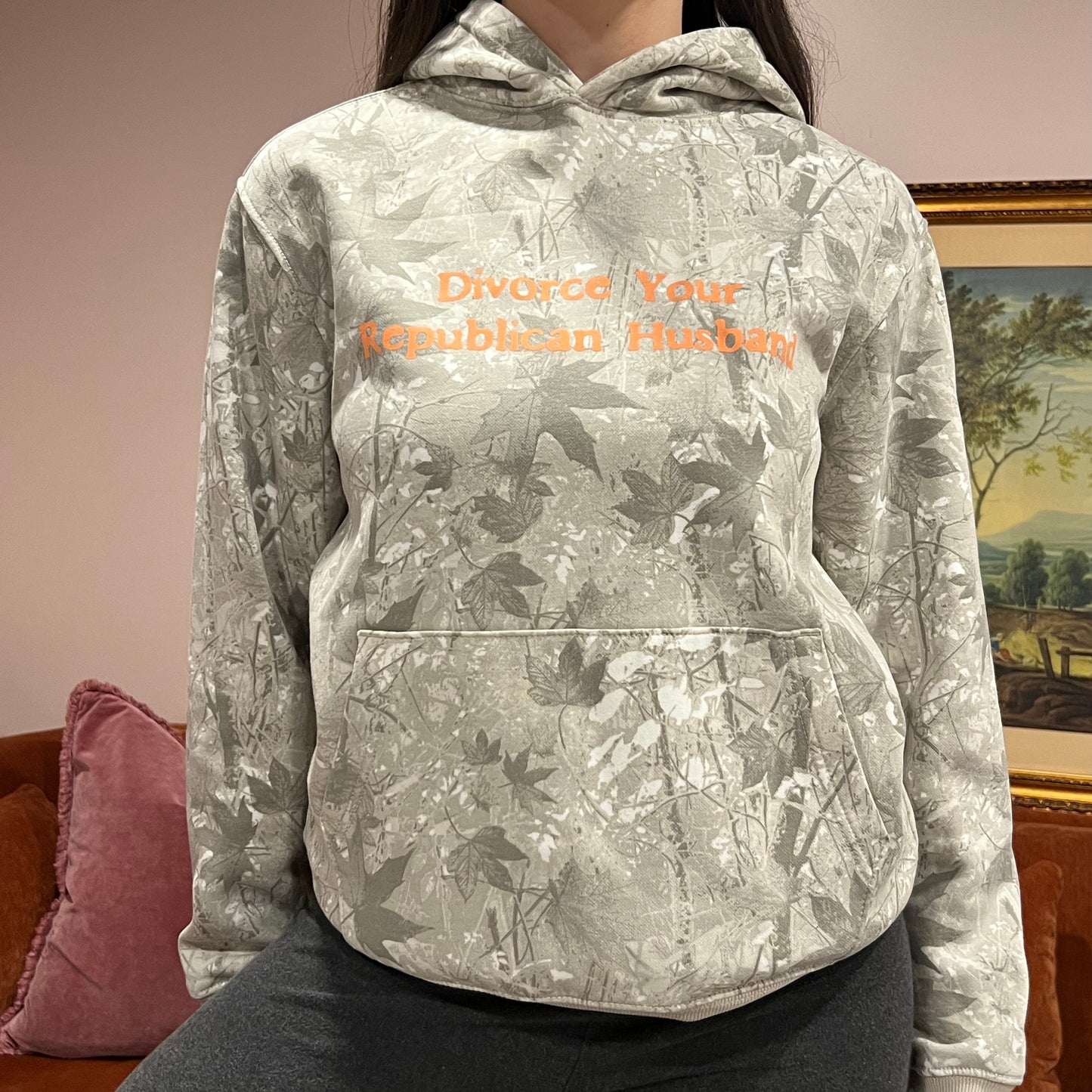 DIVORCE YOUR REPUBLICAN HUSBAND white camo hoodie with orange text (S)
