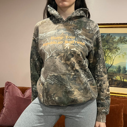 DUMP YOUR REPUBLICAN BOYFRIEND camo hoodie with orange text (M)