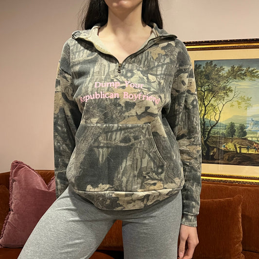 DUMP YOUR REPUBLICAN BOYFRIEND camo zip-up with pink text (M)