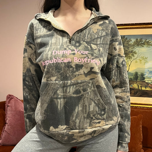 DUMP YOUR REPUBLICAN BOYFRIEND camo zip-up with pink text (M)