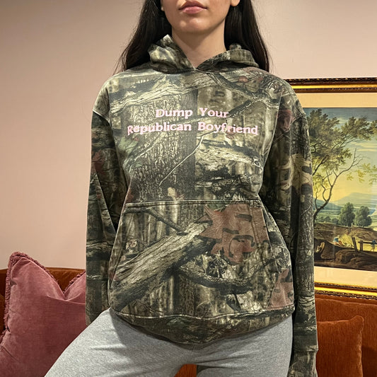 DUMP YOUR REPUBLICAN BOYFRIEND camo hoodie with pink text (M)