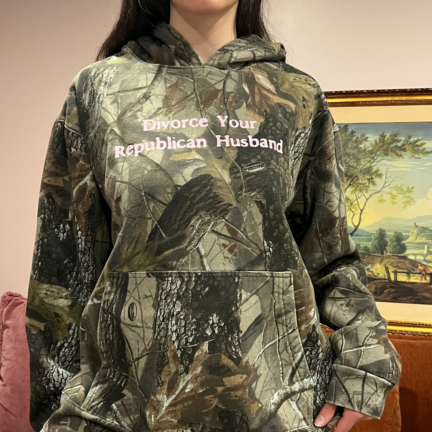 DIVORCE YOUR REPUBLICAN HUSBAND camo hoodie with pink text (XL)
