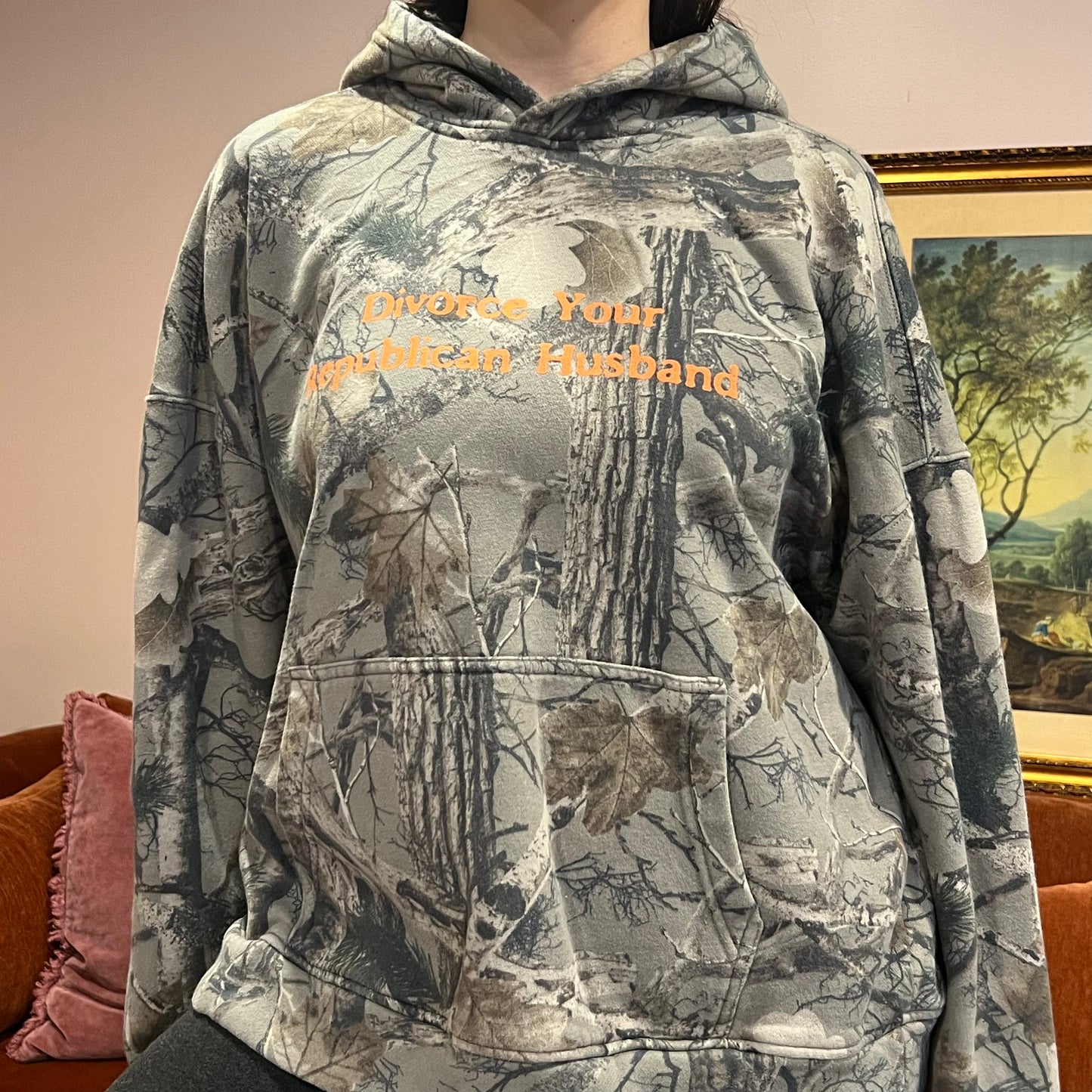 DIVORCE YOUR REPUBLICAN HUSBAND camo hoodie with orange text (XL)