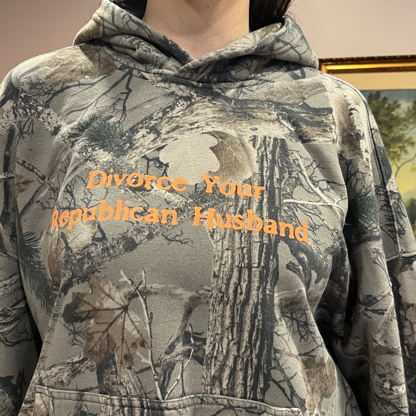 DIVORCE YOUR REPUBLICAN HUSBAND camo hoodie with orange text (XL)