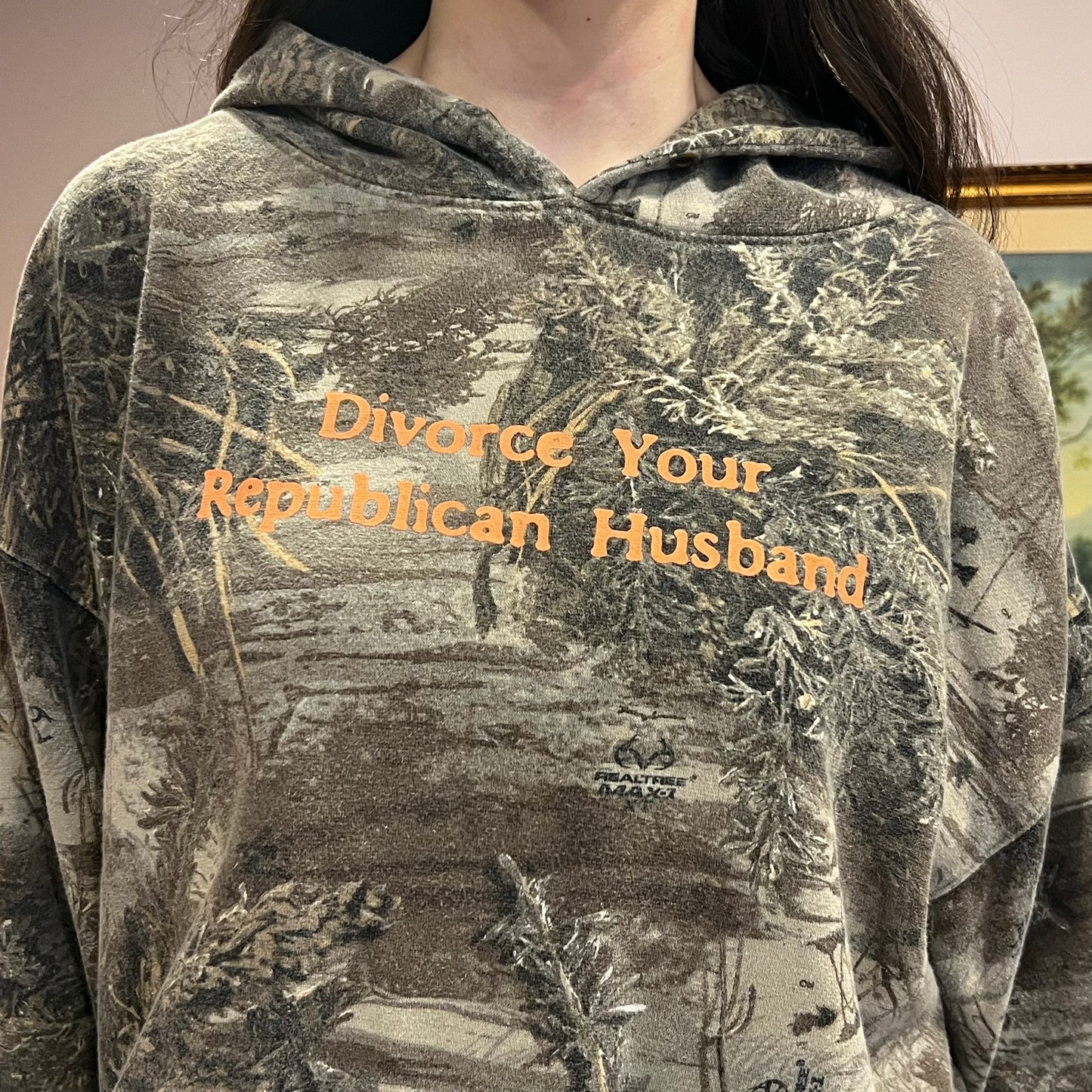 DIVORCE YOUR REPUBLICAN HUSBAND camo hoodie with orange text (XL)