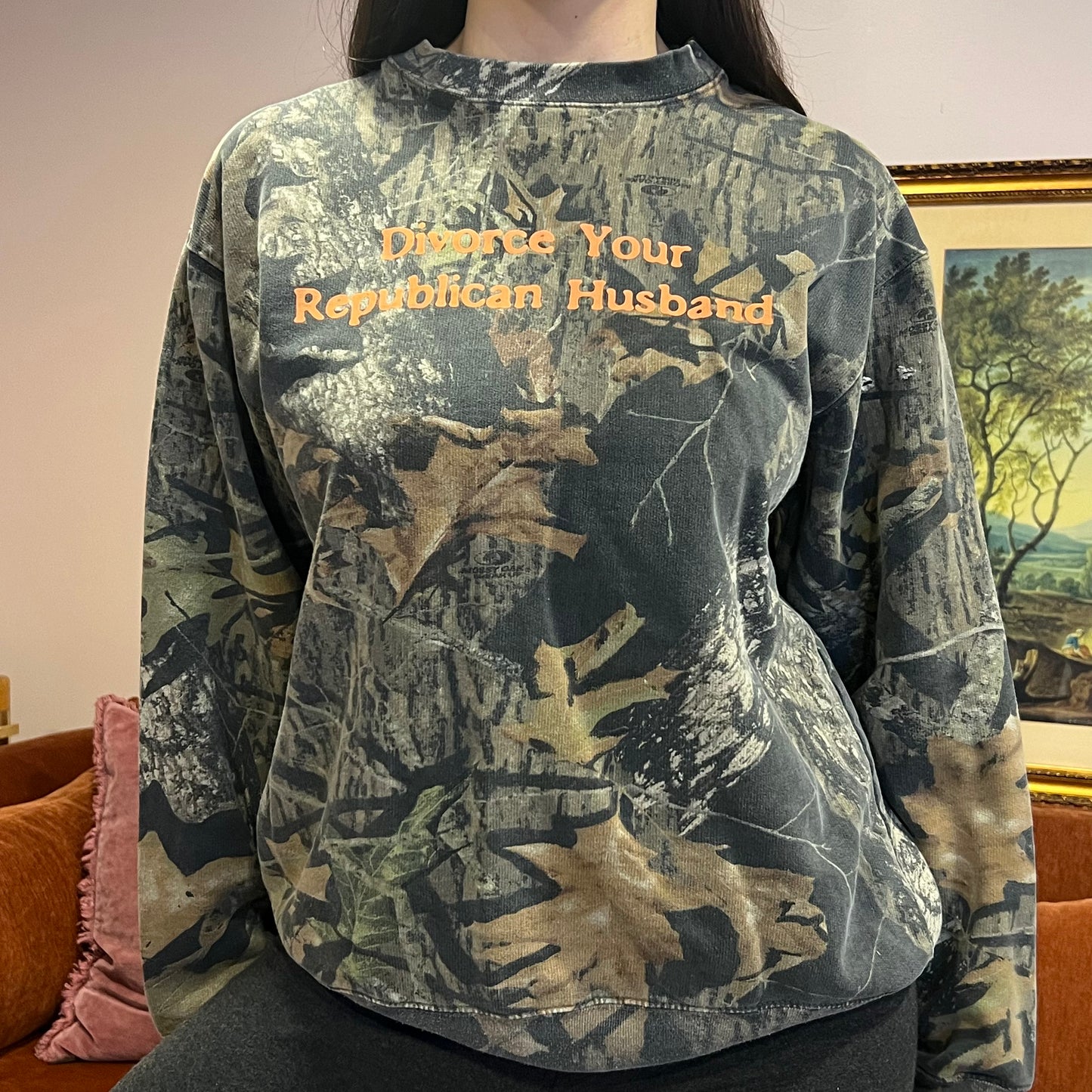 DIVORCE YOUR REPUBLICAN HUSBAND camo crewneck with orange text (L)
