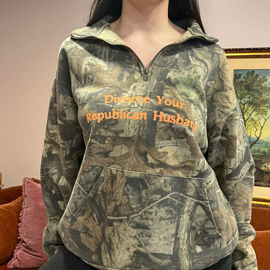 DIVORCE YOUR REPUBLICAN HUSBAND camo zip-up with orange text (L)