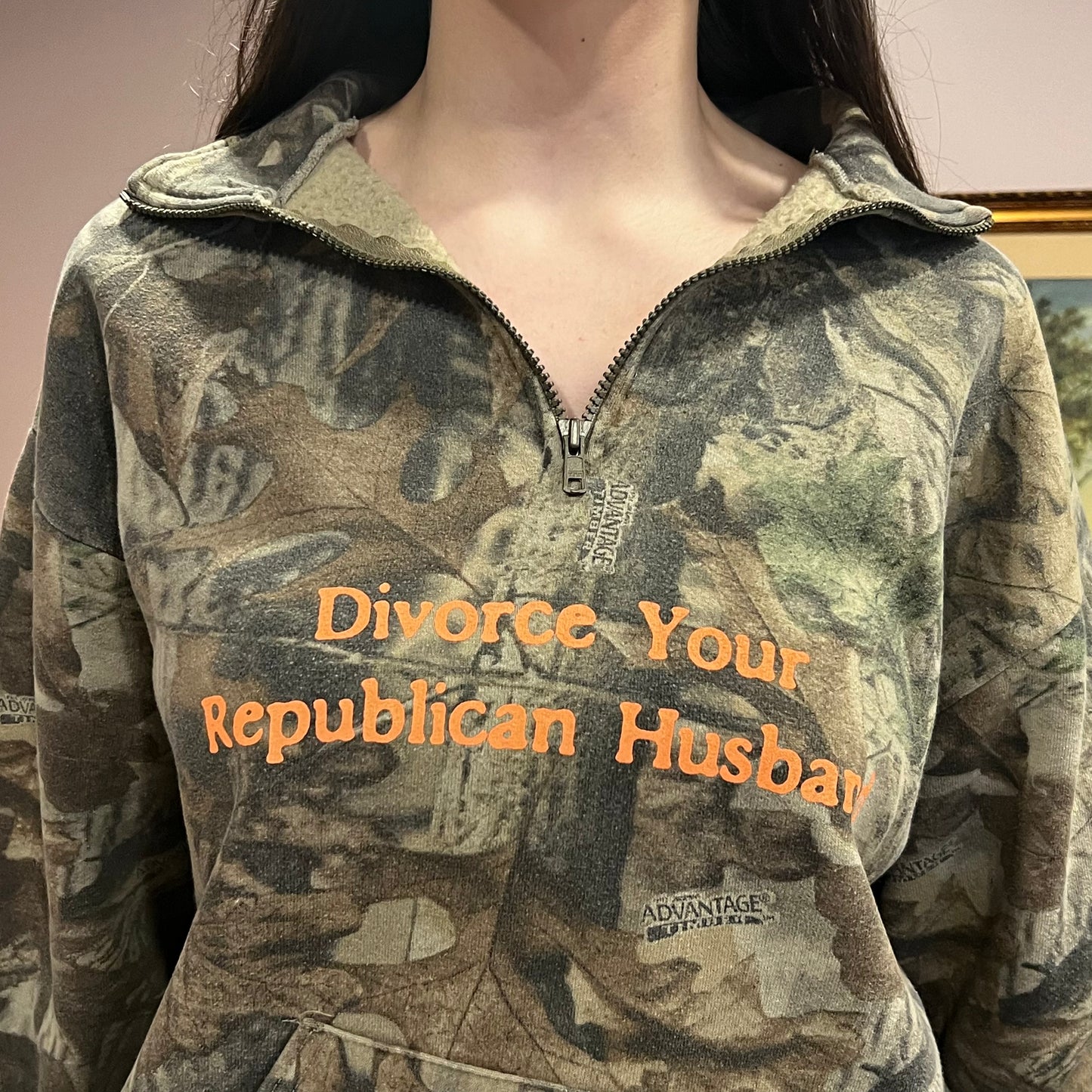 DIVORCE YOUR REPUBLICAN HUSBAND camo zip-up with orange text (L)