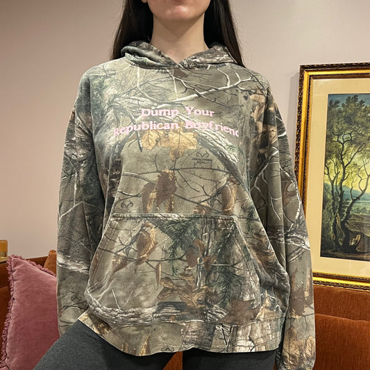 DUMP YOUR REPUBLICAN BOYFRIEND camo hoodie with pink text (XL)
