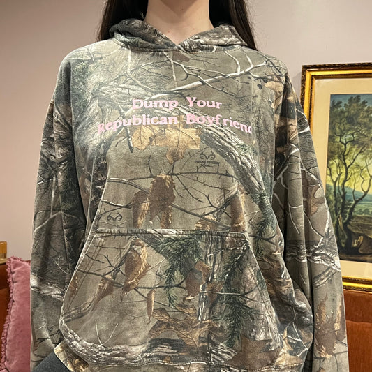 DUMP YOUR REPUBLICAN BOYFRIEND camo hoodie with pink text (XL)