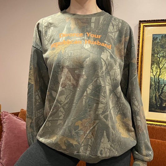 DIVORCE YOUR REPUBLICAN HUSBAND camo crewneck with orange text (2XL)