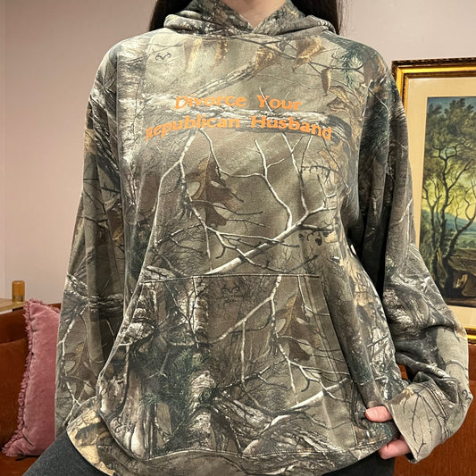 DIVORCE YOUR REPUBLICAN HUSBAND camo hoodie with orange text (XL)