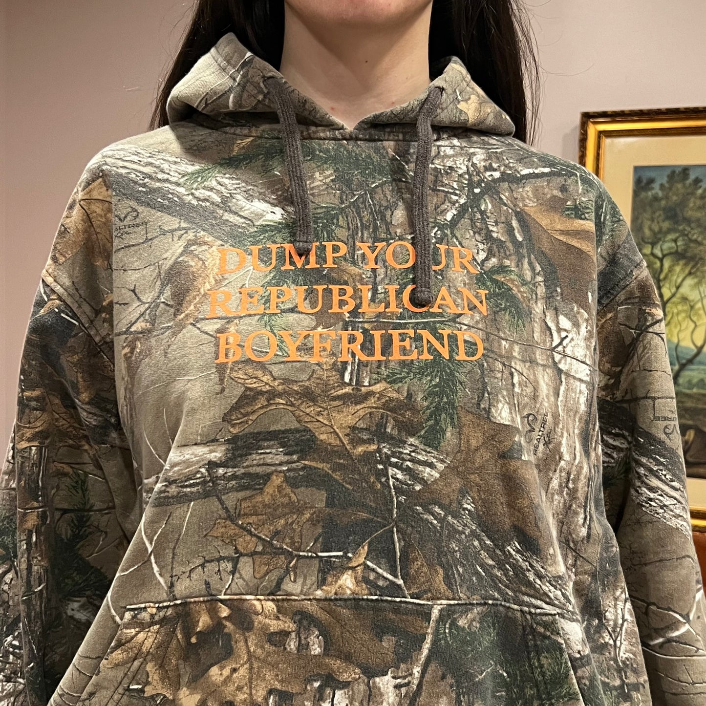 DUMP YOUR REPUBLICAN BOYFRIEND camo hoodie with orange text (XL)