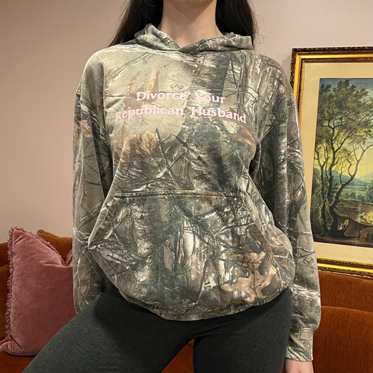 DIVORCE YOUR REPUBLICAN HUSBAND camo hoodie with pink text (M)