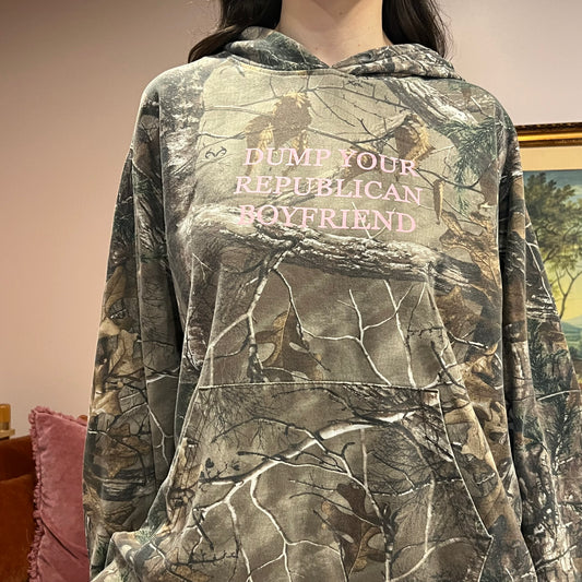 DUMP YOUR REPUBLICAN BOYFRIEND camo hoodie with pink text (XL)