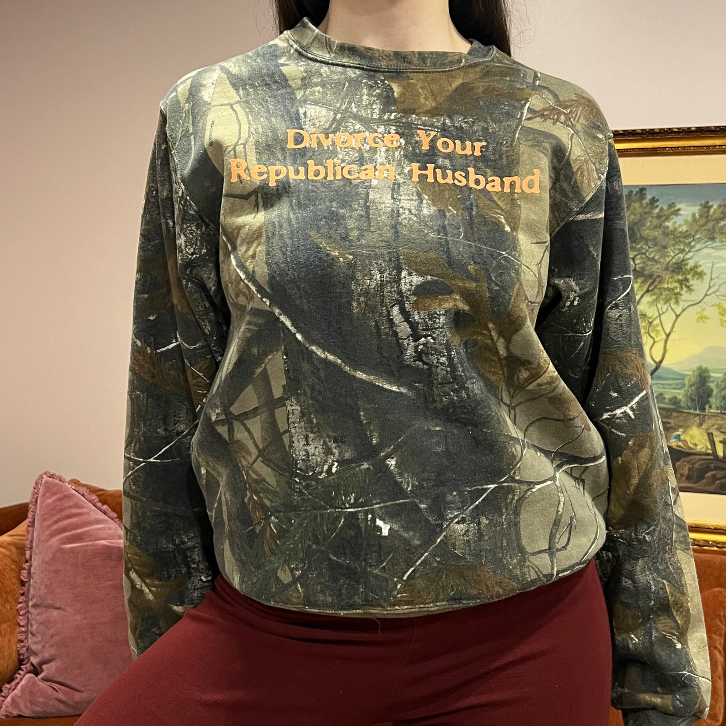 DIVORCE YOUR REPUBLICAN HUSBAND camo crewneck with orange text (S)